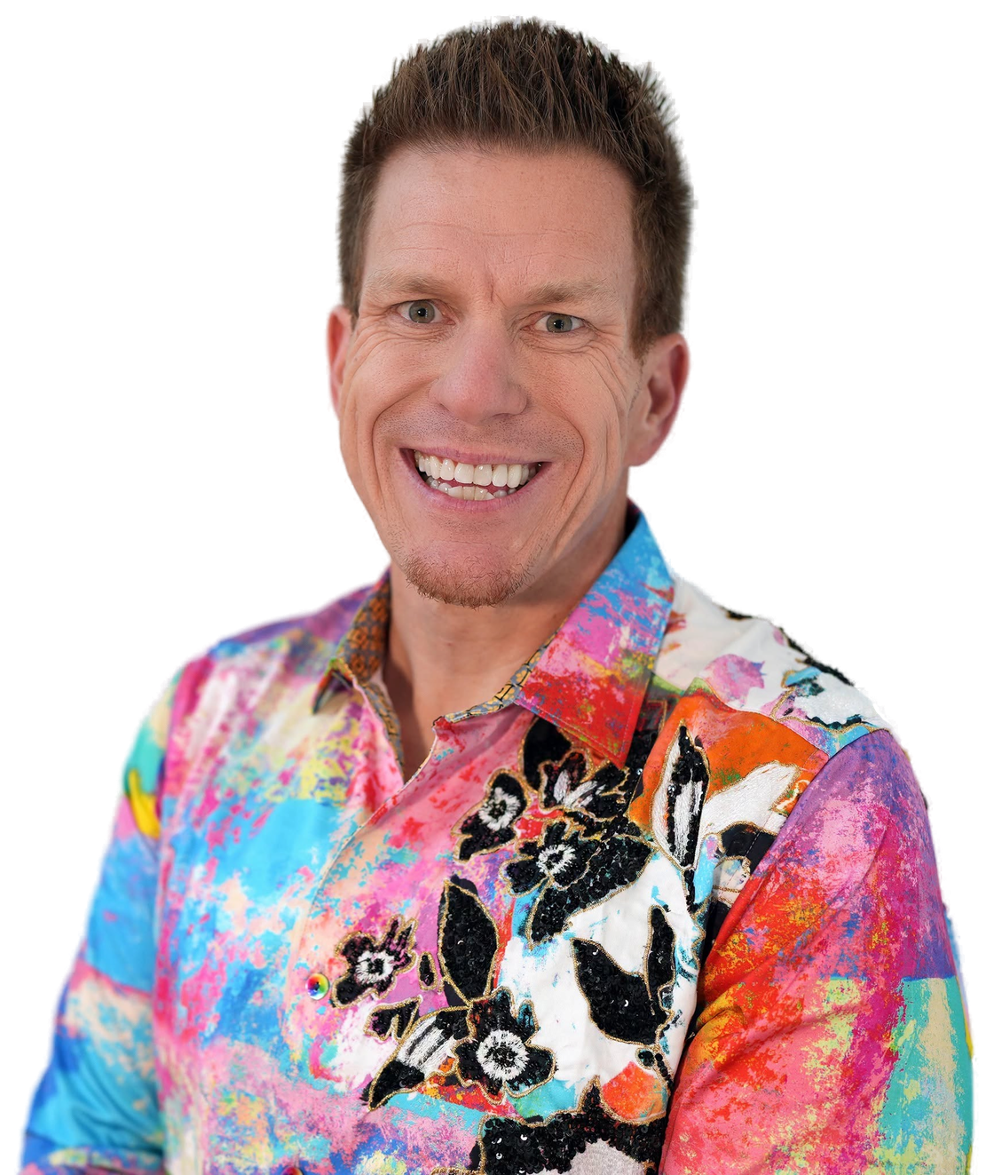 Jared Guynes smiling in a colorful floral shirt